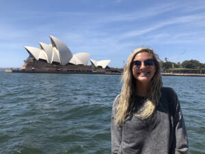 Salem College Study Abroad student standing for a photo with Sydney, Australia in the background.