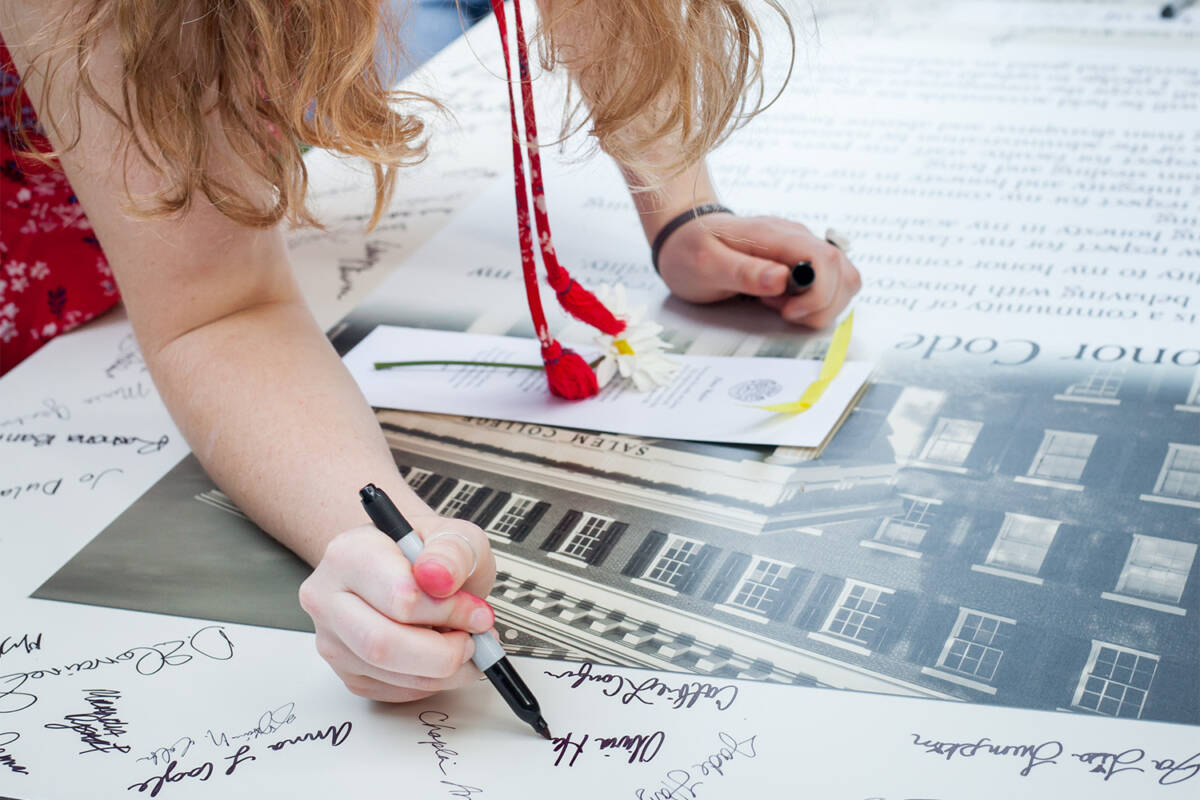 Salem student signing the honor code